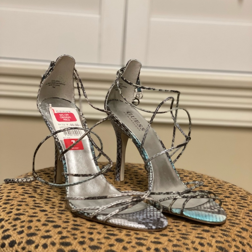 Gently used multi colored strappy heels. Size 7